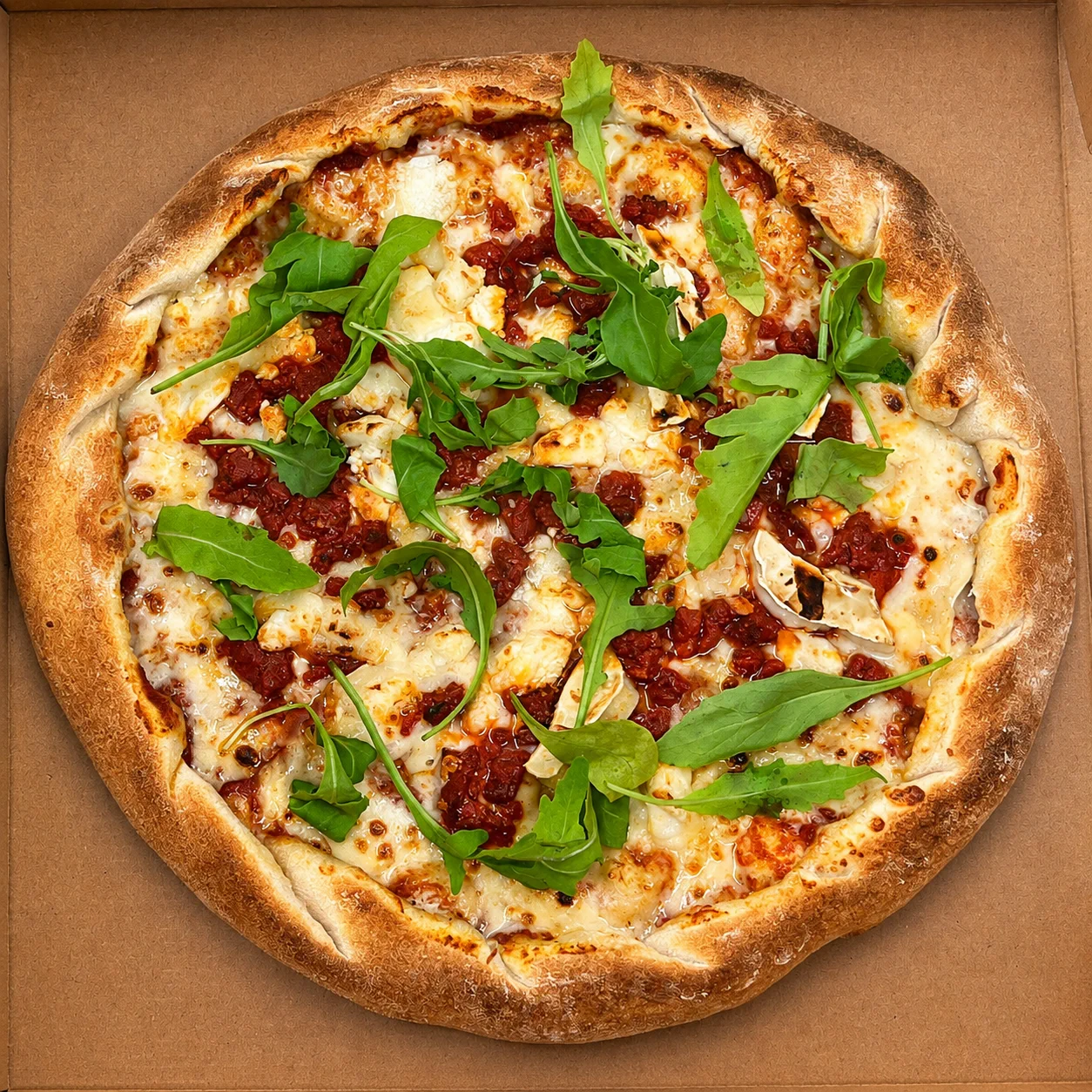 A freshly baked pizza topped with rocket